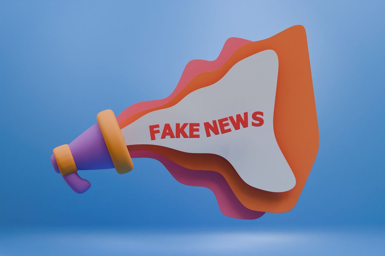 Ilustração 3D de um megafone colorido com a expressão “Fake News”, representando a disseminação de desinformação nos meios digitais.